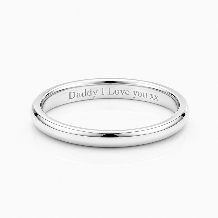 A polished silver band ring engraved with the message 'Daddy I Love you xx' on a clean white background.