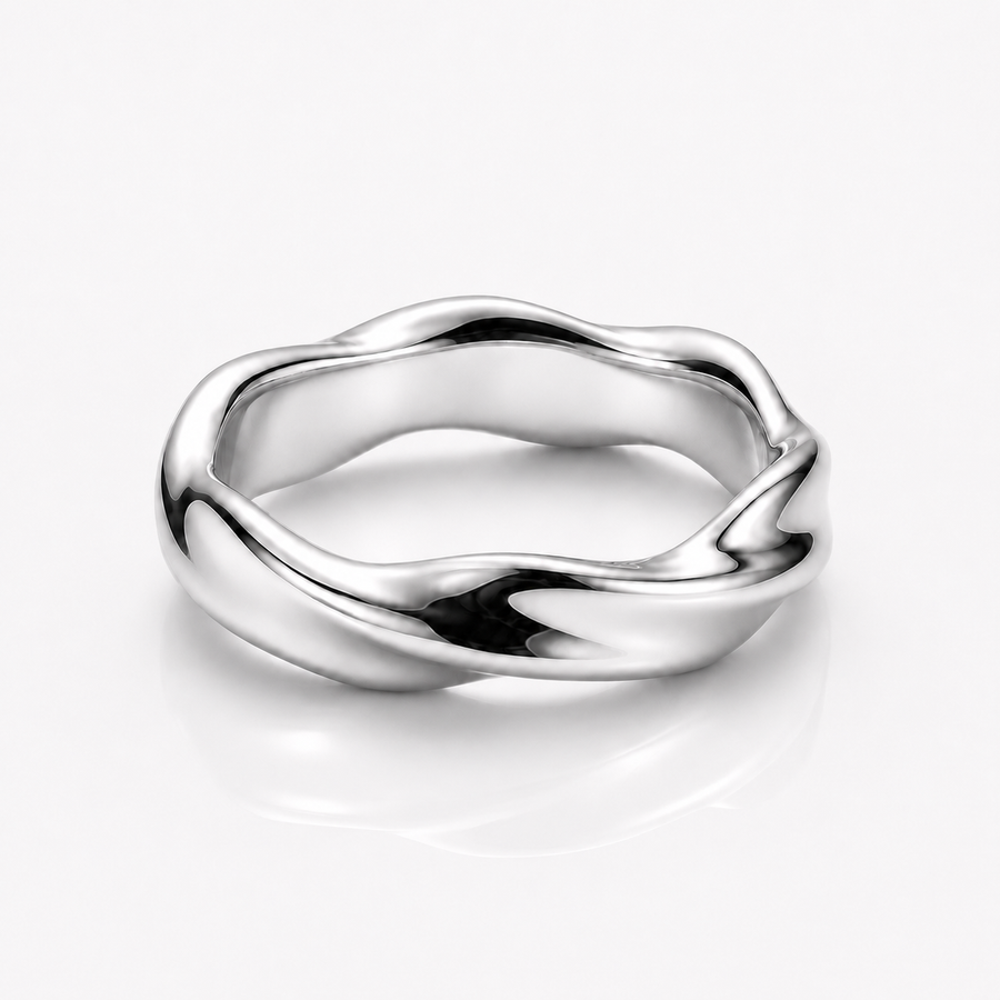A polished silver ring with a wavy, fluid organic shape, shown on a clean white background with a soft reflection underneath.