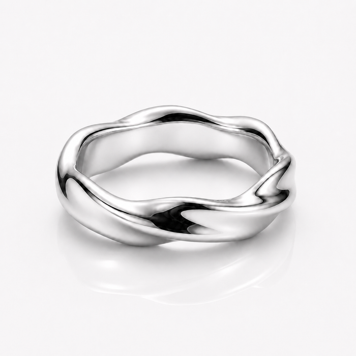 A polished silver ring with a wavy, fluid organic shape, shown on a clean white background with a soft reflection underneath.
