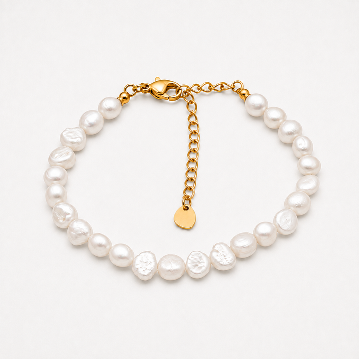 A baroque pearl bracelet with a gold chain extender and lobster clasp, displayed on a clean white background.