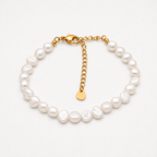 A baroque pearl bracelet with a gold chain extender and lobster clasp, displayed on a clean white background.