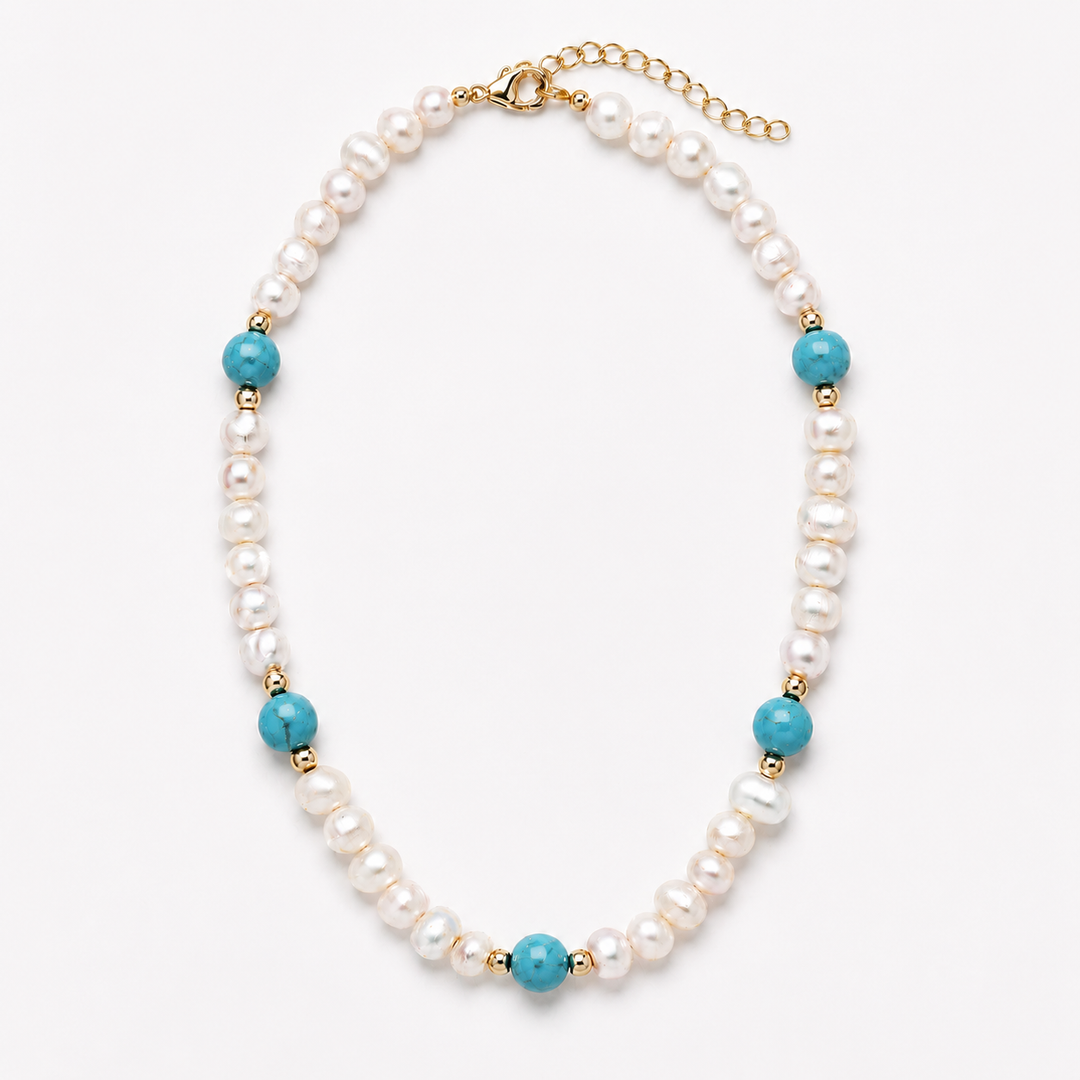 A pearl beaded necklace with turquoise blue beads and gold spacer accents, displayed on a clean white background.