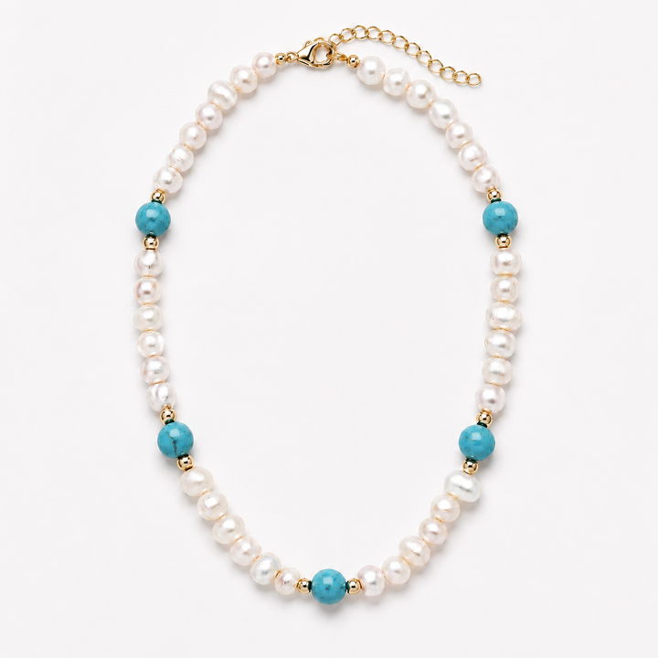 A pearl beaded necklace with turquoise blue beads and gold spacer accents, displayed on a clean white background.