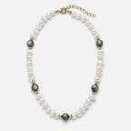 A pearl and green stone beaded necklace with gold-toned spacer beads and a gold clasp, shown on a light gray background.