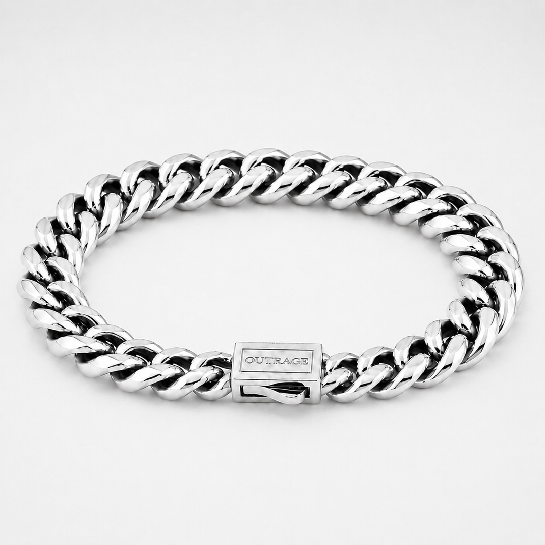 A silver-toned Cuban link bracelet with a polished finish and a clasp engraved with the brand name 'OUTRAGE', shown on a light gray background.