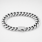 A silver-toned Cuban link bracelet with a polished finish and a clasp engraved with the brand name 'OUTRAGE', shown on a light gray background.