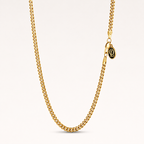A gold-toned chain necklace with a lobster clasp and a small oval pendant featuring a black background and gold monogram, displayed on a clean off-white background.