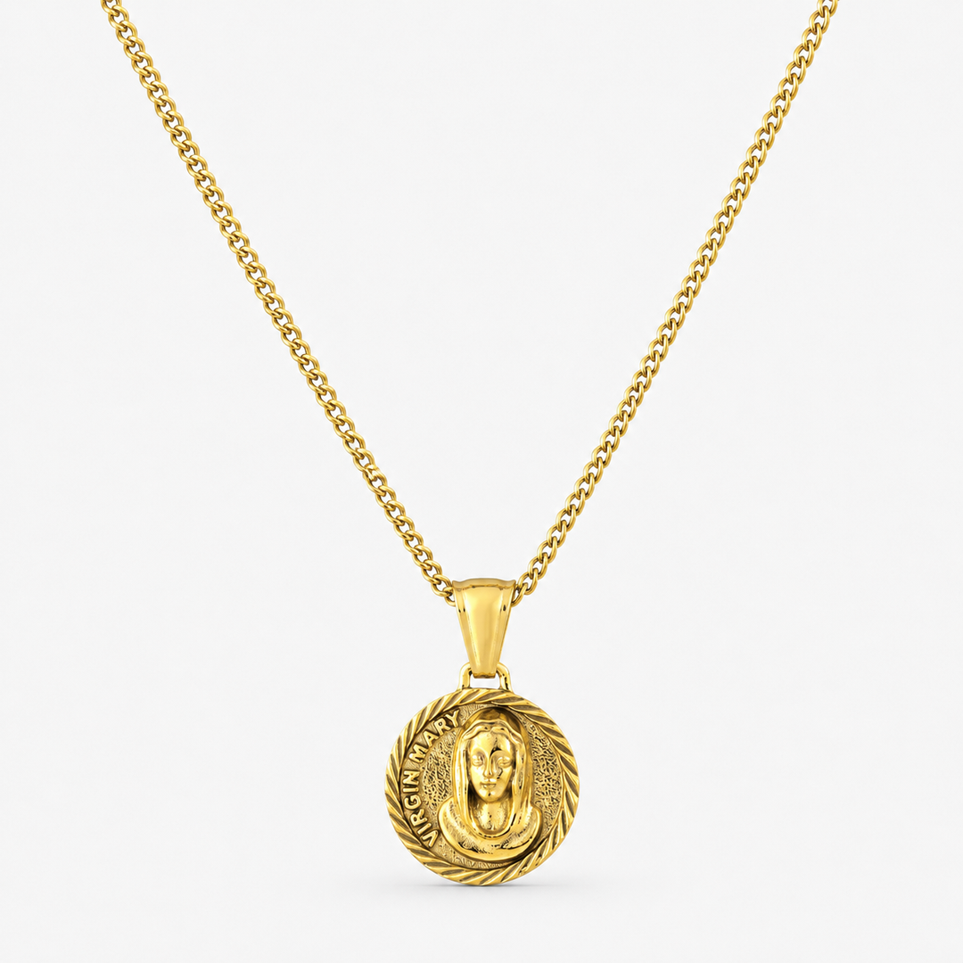 A gold chain necklace with a circular pendant featuring a detailed Buddha face in relief, set against a clean white background.