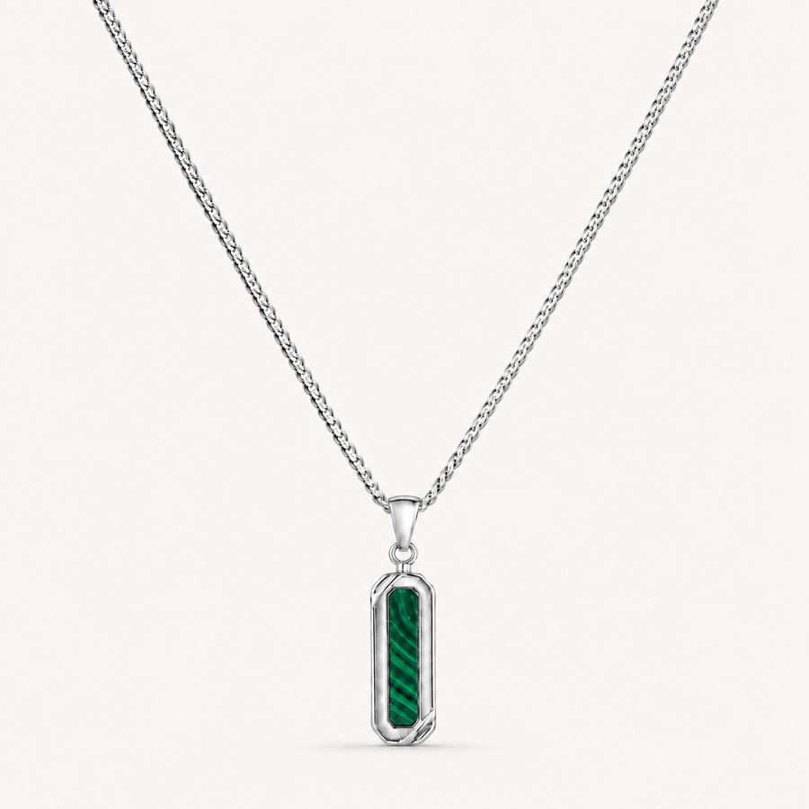A silver-toned chain necklace with a vertical rectangular pendant featuring a textured green inlay, shown on a light off-white background.