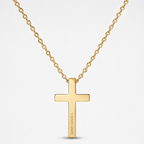 A gold cross pendant necklace with a matching gold chain, shown against a light gray background. The pendant features the engraved text 'JESUS IS THE ONLY WAY'.
