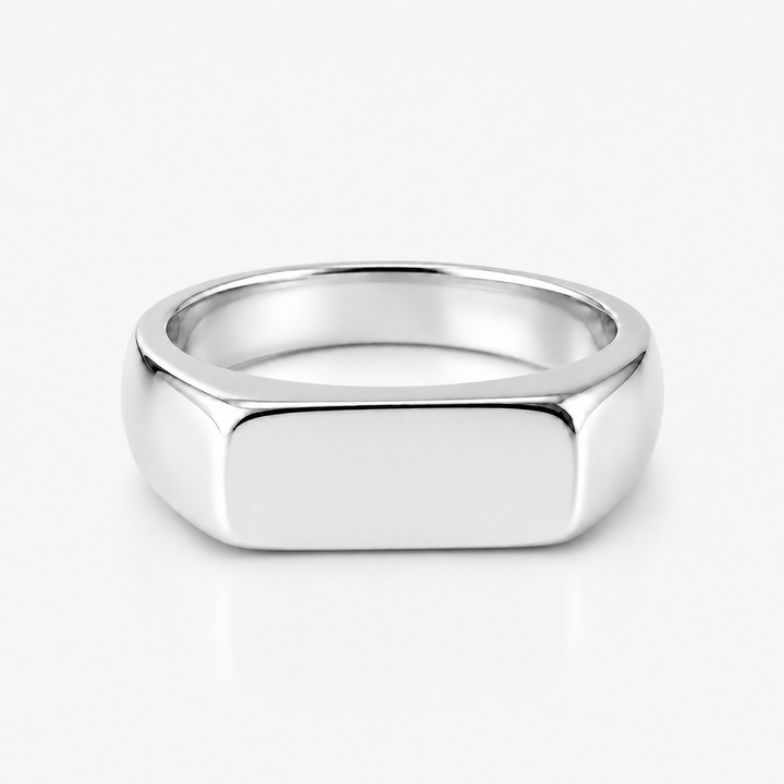 A polished silver signet ring with a flat, rectangular face, shown on a clean white background.