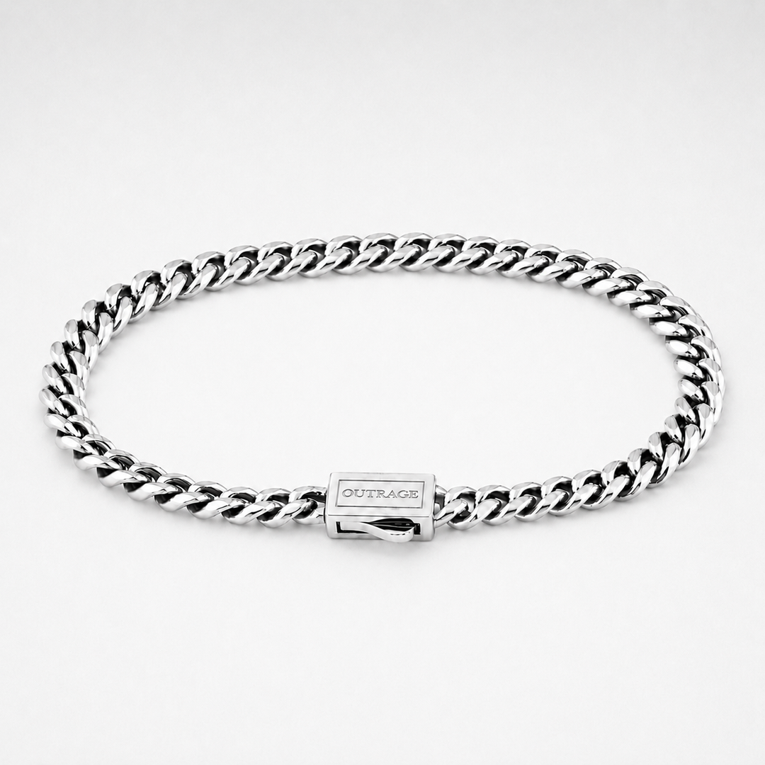 A silver-tone Cuban link chain bracelet with a rectangular clasp engraved with the brand name 'OUTRAGE', displayed on a clean white background.