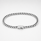 A silver-tone Cuban link chain bracelet with a rectangular clasp engraved with the brand name 'OUTRAGE', displayed on a clean white background.