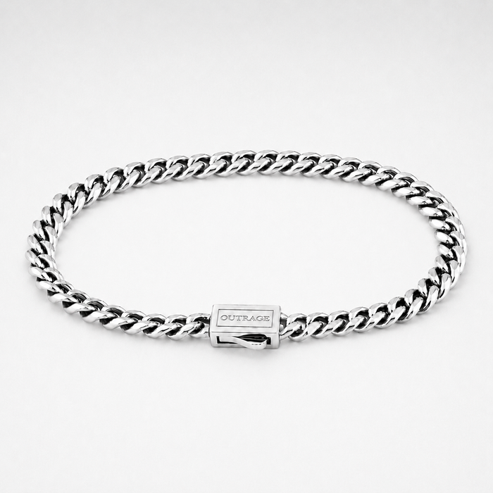A silver-tone Cuban link chain bracelet with a rectangular clasp engraved with the brand name 'OUTRAGE', displayed on a clean white background.