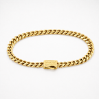 A gold Cuban link chain bracelet with a rectangular clasp engraved with the brand name 'OUTRAGE', displayed on a clean white background.
