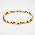 A gold-tone Cuban link chain bracelet with a rectangular clasp engraved with 'I LOVE YOU XXX', shown on a clean white background.