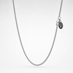 Silver chain necklace on a light gray background
