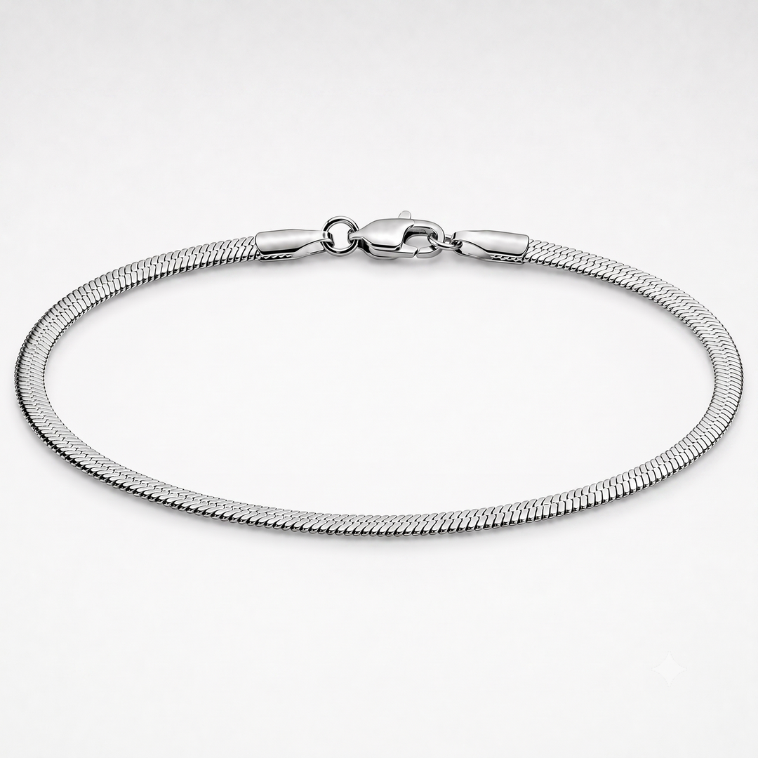 A silver-toned metal snake chain bracelet with a lobster clasp, displayed in a circular shape on a clean white background.