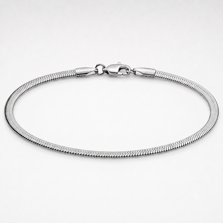 A silver-toned metal snake chain bracelet with a lobster clasp, displayed in a circular shape on a clean white background.