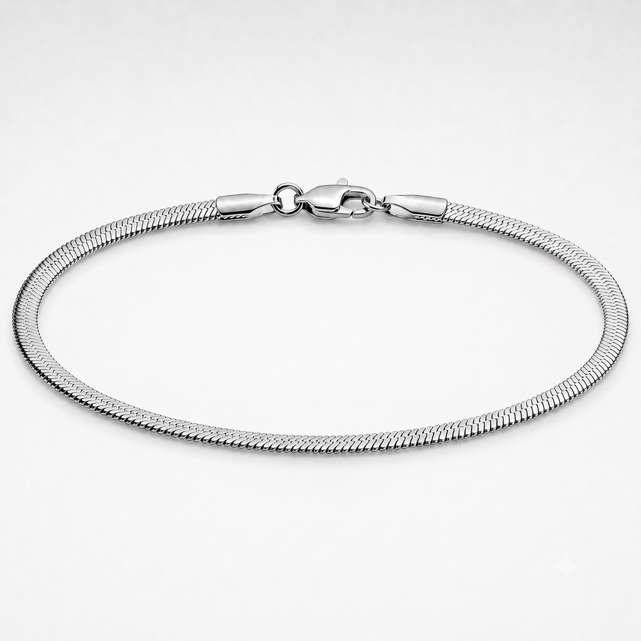 A silver-toned metal snake chain bracelet with a lobster clasp, displayed in a circular shape on a clean white background.