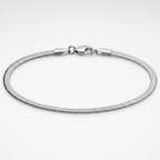 A silver-toned metal snake chain bracelet with a lobster clasp, displayed in a circular shape on a clean white background.