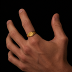 Zeus Gold Ring On hand model, on blck bckground
