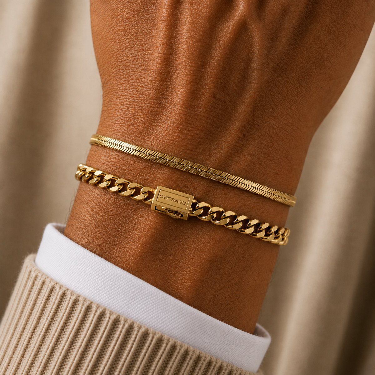 Two gold bracelets worn on a person's wrist, including a thin snake chain bracelet and a thicker curb chain bracelet with a rectangular clasp engraved with 'CITIZEN'.