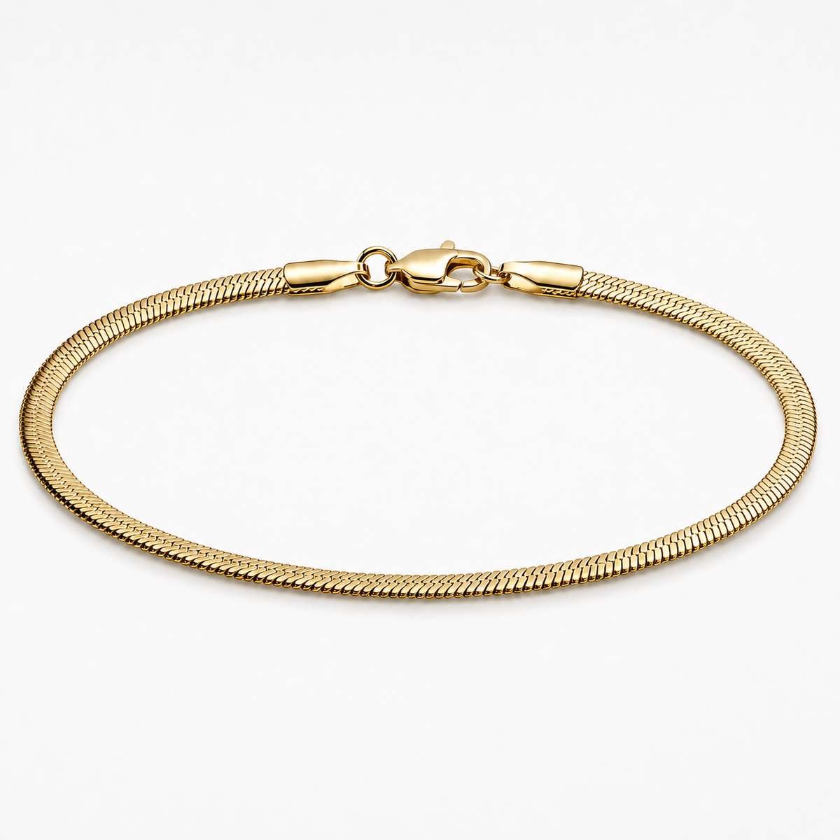 A gold-colored snake chain bracelet with a lobster clasp, displayed in a neat circular shape on a clean white background.