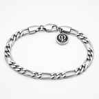 A silver-toned Figaro chain bracelet with a lobster clasp and a small round charm featuring an interlocking 'L' monogram, shown on a clean white background.
