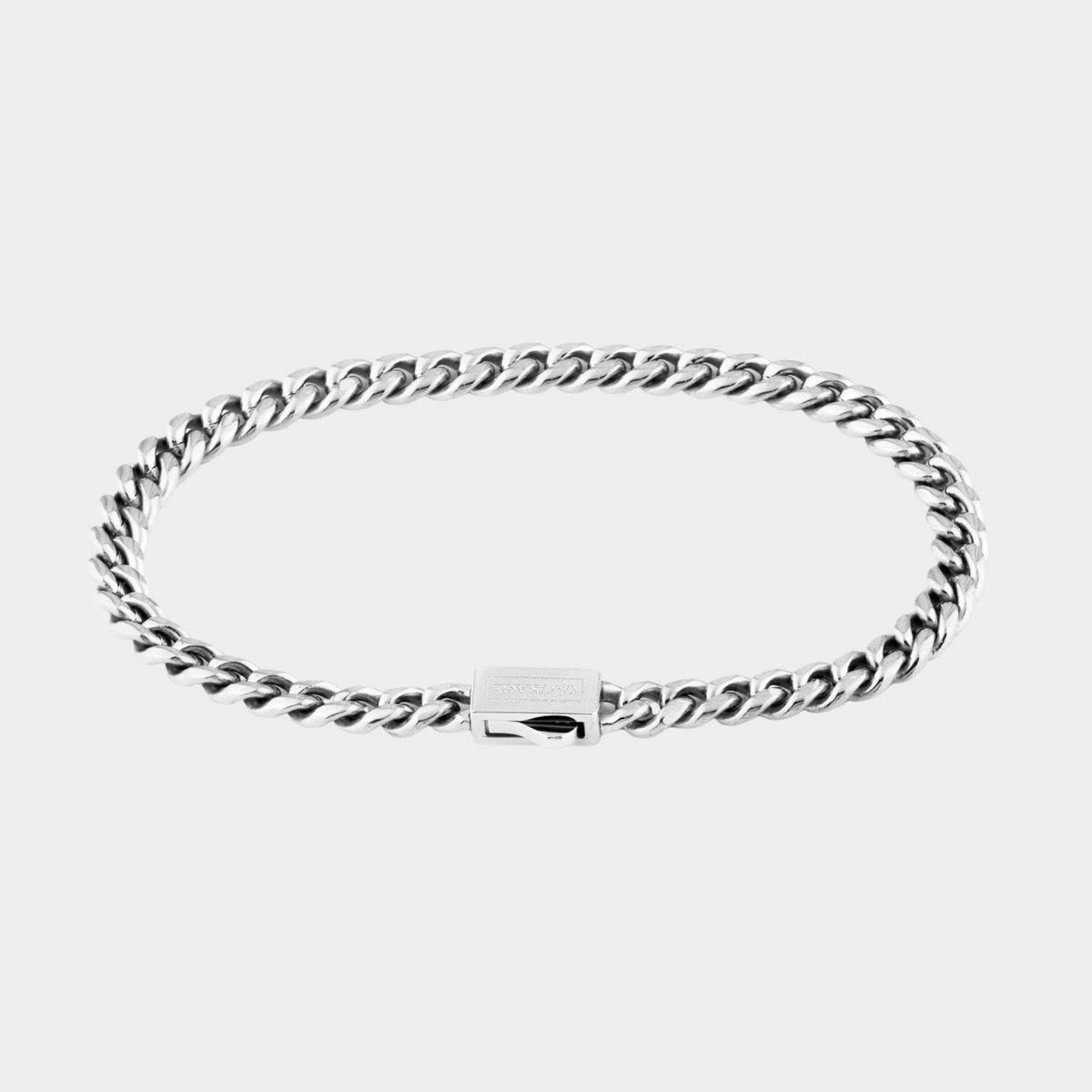 Silver chain bracelet on a white background
