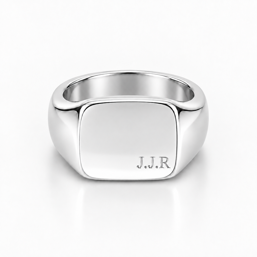 A polished silver signet ring with a square face engraved with the initials 'J.J.R', shown on a clean white background.