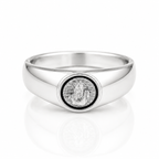 A polished silver signet ring featuring a circular medallion with a religious figure, set against a clean white background with a soft reflection.
