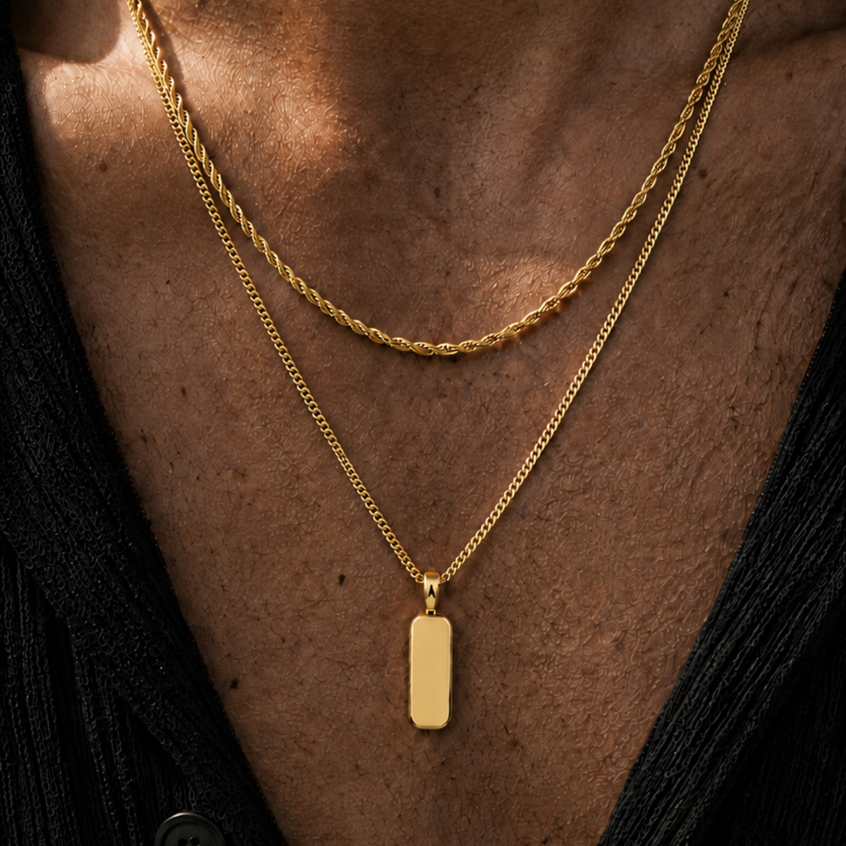 Man Wearing a gold chain and pendant in the sun with an open neck top