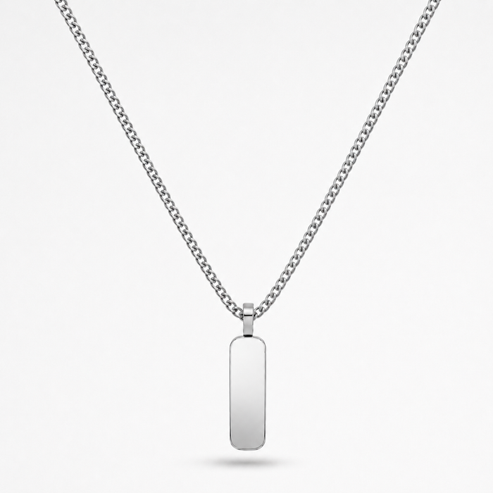 A silver-toned stainless steel chain necklace with a flat, polished rectangular dog tag pendant, shown against a light gray background.