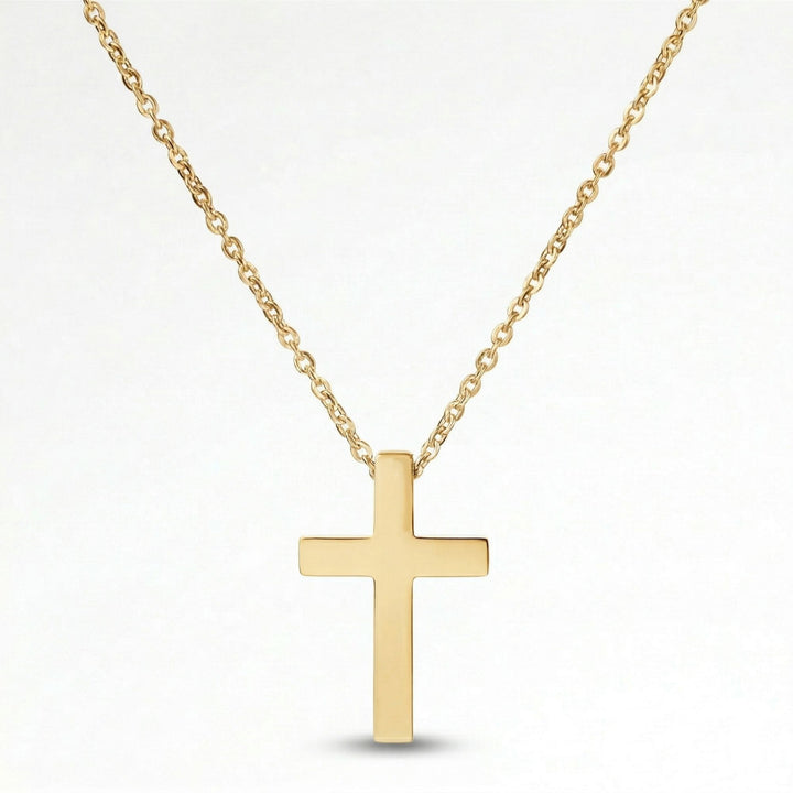 A gold cross pendant necklace against a white background.