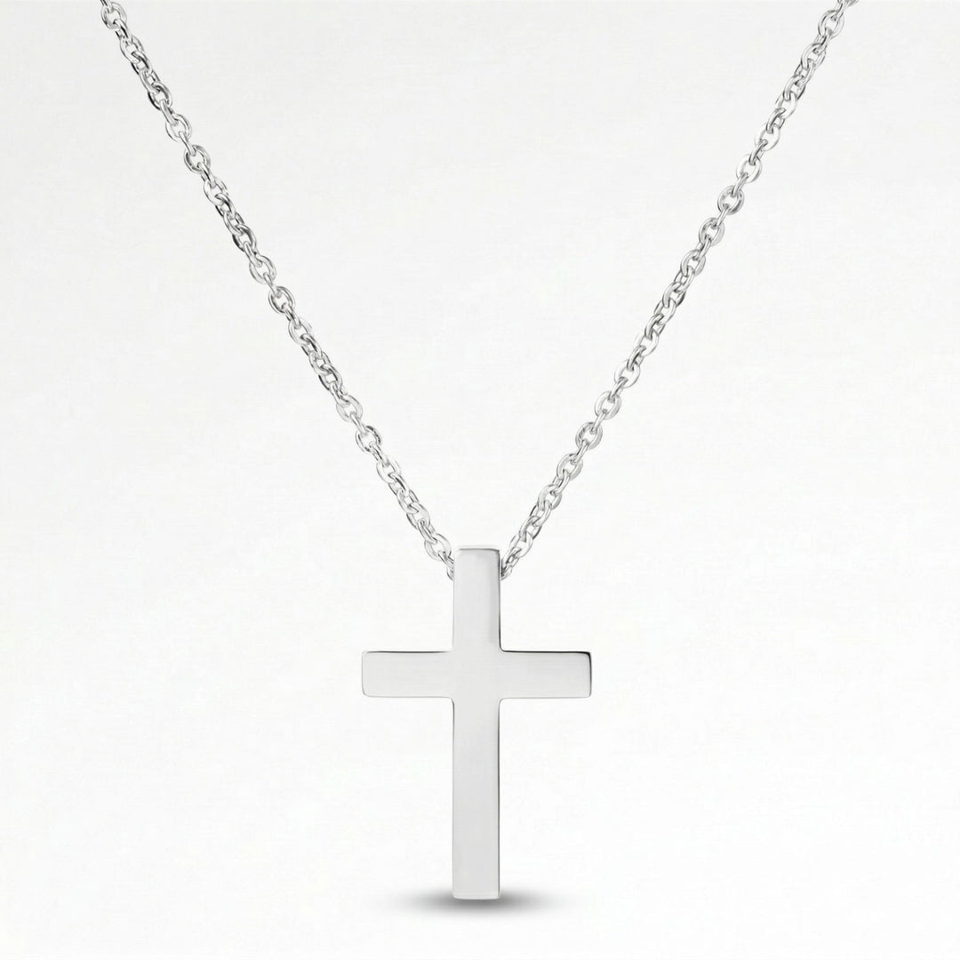 A silver cross pendant necklace against a white background.