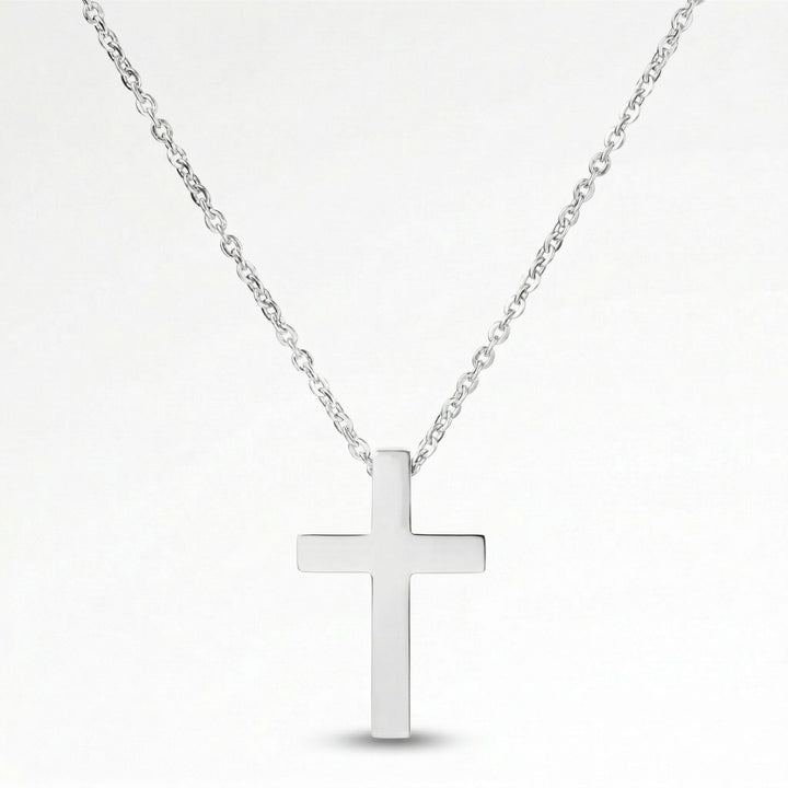 A silver cross pendant necklace against a white background.