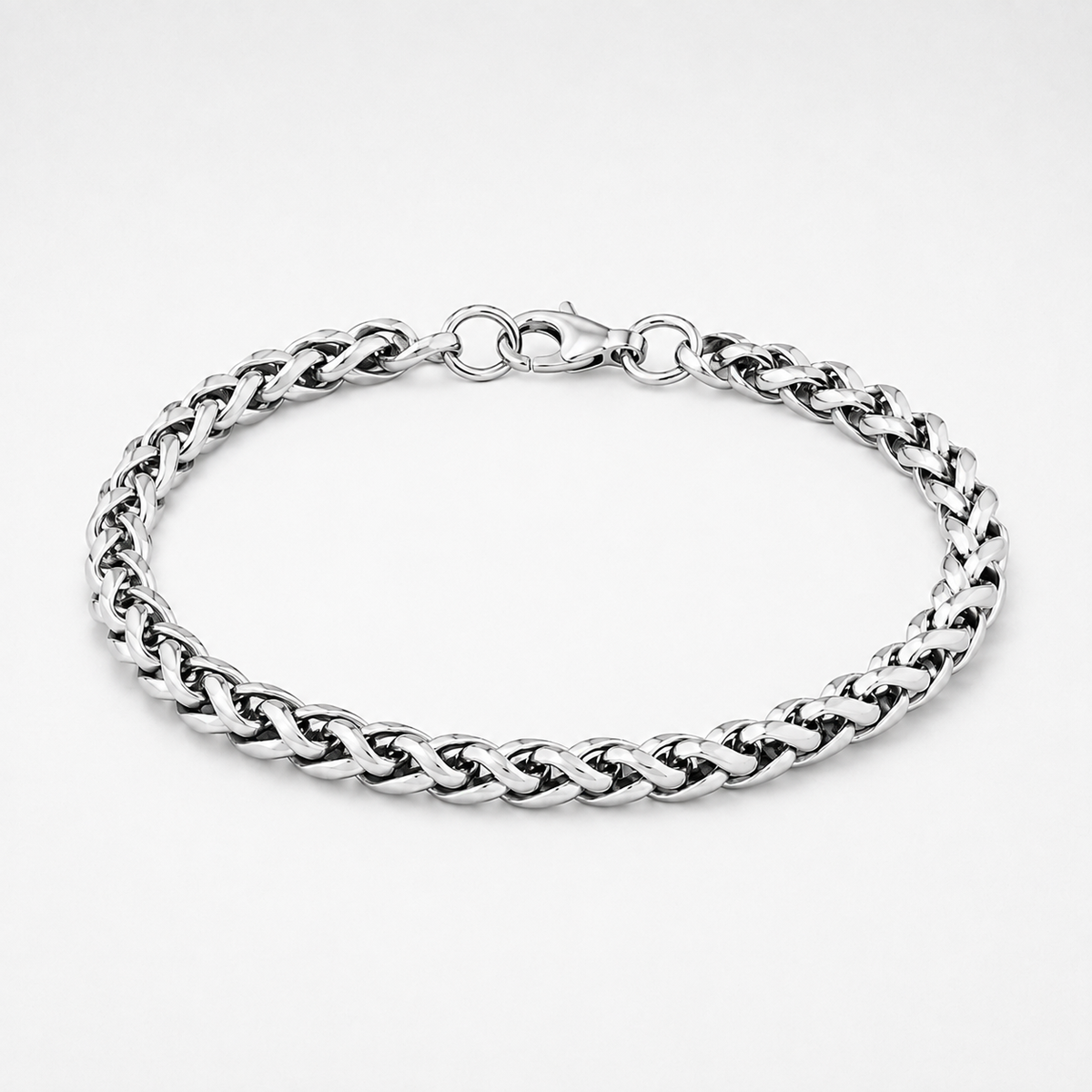 A silver-toned metal curb chain bracelet with a lobster clasp, displayed on a clean white background.