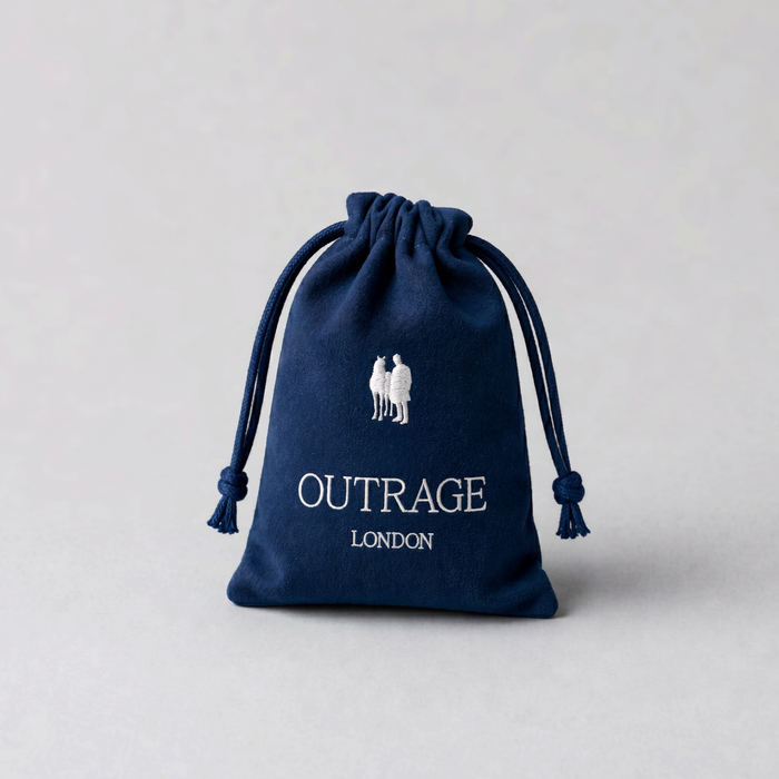 Navy blue drawstring bag with 'Outrage London' branding on a light gray background